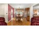 Comfortable dining room featuring a wooden table set and a glass cabinet at 10338 Se 178Th St, Summerfield, FL 34491