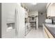 Bright kitchen featuring a white refrigerator, oven, and a convenient microwave at 10338 Se 178Th St, Summerfield, FL 34491