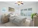 Serene bedroom with large windows, plush bedding, and ample natural light at 1041 Linehart Dr, Winter Garden, FL 34787