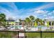 Resort-style community pool with lounge chairs and lush landscaping at 1041 Linehart Dr, Winter Garden, FL 34787