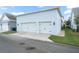 Spacious two-car garage with white doors and black hardware at 1041 Linehart Dr, Winter Garden, FL 34787