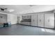 This garage has custom storage cabinets and a sealed concrete floor at 10413 Lake Hill Dr, Clermont, FL 34711