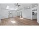 Bright, modern living room featuring skylights and hardwood flooring at 10413 Lake Hill Dr, Clermont, FL 34711