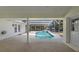 The screened-in pool offers a cool escape from the summer heat at 10413 Lake Hill Dr, Clermont, FL 34711