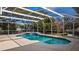 Large screened pool and spa with room for outdoor seating at 10413 Lake Hill Dr, Clermont, FL 34711