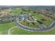 Aerial view of the community clubhouse and manicured lawns at 1067 Mesa Verde Court, Clermont, FL 34711