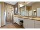 Bright bathroom with walk in shower, double sinks, and granite countertops at 1067 Mesa Verde Court, Clermont, FL 34711