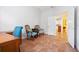 Office space with two ornate chairs, view of a kitchen through an open doorway, and tile flooring at 1067 Mesa Verde Court, Clermont, FL 34711