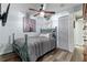 Cozy bedroom with stylish gray decor, including an ornate bedframe and decorative wall art at 1102 N Palmetto St, Leesburg, FL 34748