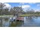 Boat dock equipped with a boat lift and shed, offering convenient waterfront access and storage at 1102 N Palmetto St, Leesburg, FL 34748