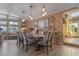 This elegant dining room features stylish lighting and a view to the lake at 1102 N Palmetto St, Leesburg, FL 34748