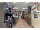 Galley kitchen with stainless steel appliances and custom cabinets at 1102 N Palmetto St, Leesburg, FL 34748