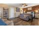 Cozy main bedroom features a wood accent wall, a ceiling fan, and ample natural light at 1102 N Palmetto St, Leesburg, FL 34748