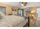 Spacious main bedroom featuring a seating area, flat-screen TV, and outdoor access at 1102 N Palmetto St, Leesburg, FL 34748