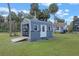 Outbuilding/shed with open shelving and ramp for easy access at 1102 N Palmetto St, Leesburg, FL 34748