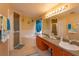 Bathroom with double sink vanity, garden tub, walk-in shower, and warm colored walls at 1123 Bluegrass Dr, Groveland, FL 34736