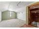 Cozy attic space featuring unique architectural details and a window, offering natural light at 11325 Michael John Rd, Howey In The Hills, FL 34737