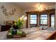 Charming kitchen island featuring a breakfast bar with stainless sink, and decorative floral arrangement at 11325 Michael John Rd, Howey In The Hills, FL 34737