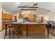 Bright open kitchen with wood cabinets and a large kitchen island at 11325 Michael John Rd, Howey In The Hills, FL 34737