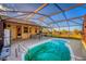 Private pool area enclosed with clear cage, ideal for relaxation and outdoor entertainment at 11325 Michael John Rd, Howey In The Hills, FL 34737