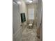 Cozy bathroom with a toilet, neutral paint and small window at 11425 Alameda Sandra Dr, Clermont, FL 34711