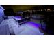 Backyard at night featuring pool, patio, sofa, shed and atmospheric lighting at 119 Cory Ct, Auburndale, FL 33823
