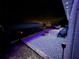 Nighttime backyard featuring fire pit, gravel area, patio furniture and shed at 119 Cory Ct, Auburndale, FL 33823