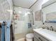 Modern bathroom featuring glass shower, neutral tile, and stylish vanity with storage at 119 Cory Ct, Auburndale, FL 33823