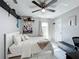 Bedroom features white floors, ceiling fan and view to the backyard at 119 Cory Ct, Auburndale, FL 33823