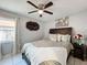 Bedroom with neutral decor, ceiling fan, and a large window at 119 Cory Ct, Auburndale, FL 33823