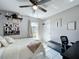 Bedroom features white floors, ceiling fan and view to the backyard at 119 Cory Ct, Auburndale, FL 33823