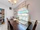 Charming dining room with wood table, seating for four, and natural light at 119 Cory Ct, Auburndale, FL 33823