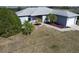 Charming single-story home with a well-maintained yard, driveway, and two-car garage at 119 Cory Ct, Auburndale, FL 33823