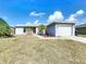 Charming single-story home with a well-maintained yard, driveway, and two-car garage at 119 Cory Ct, Auburndale, FL 33823