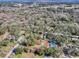 Aerial view of property with home, in-ground pool, and surrounding landscape at 11915 Cr 680, Webster, FL 33597