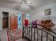 Bedroom featuring a decorative rug, and an adjoining bath and wardrobe at 11915 Cr 680, Webster, FL 33597