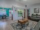 Comfortable living room featuring wood laminate flooring, a cozy built-in nook and stylish furnishings at 11915 Cr 680, Webster, FL 33597