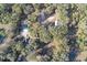 An aerial view of a property featuring homes, trees, and a private road surrounded by Florida wilderness at 1205 Darcy Rd, Lady Lake, FL 32159