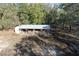 Barn in a rustic style with multiple stalls, providing shelter and a connection to nature at 1205 Darcy Rd, Lady Lake, FL 32159