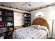 Inviting bedroom with natural light, bookcases, and a cozy quilt at 1205 Darcy Rd, Lady Lake, FL 32159