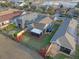 Aerial view of the property showcasing the screened lanai, patio, landscaping and proximity to a greenbelt at 123 Bayou Bend Rd, Groveland, FL 34736