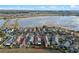 Aerial view of the home in a neighborhood close to a lake with wetlands views at 123 Bayou Bend Rd, Groveland, FL 34736