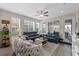 Bright living room with wood floors, plantation shutters, neutral tones, and comfortable seating at 123 Bayou Bend Rd, Groveland, FL 34736