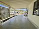 Spacious carport area that provides shelter and parking with manicured landscaping at 133 Hibiscus Way, Leesburg, FL 34748