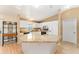 Bright kitchen with white cabinets, stainless steel appliances, and granite countertops at 1402 Sanchez Ct, The Villages, FL 32159