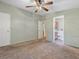 Bedroom with walk-in closet and adjoining bathroom at 1417 E Schwartz Blvd, The Villages, FL 32159