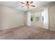 Cozy bedroom with natural light, carpet, and large windows at 1417 E Schwartz Blvd, The Villages, FL 32159