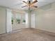 Comfortable bedroom with neutral paint colors and large windows at 1417 E Schwartz Blvd, The Villages, FL 32159