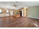 Spacious living room and kitchen area with hardwood floors and stainless steel appliances at 1417 E Schwartz Blvd, The Villages, FL 32159