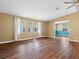 Bright living room with hardwood floors and natural light streaming through the windows at 1417 E Schwartz Blvd, The Villages, FL 32159